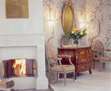 Old chairs and dresser at the fireplace Stock Photo - Premium Royalty-Free, Code: 689-05610863