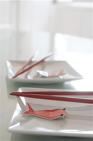 porcelain - Plates with chopsticks and fake fish Stock Photo - Premium Royalty-Free, Code: 689-05611068