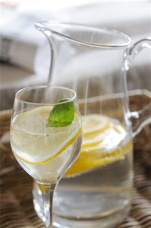 Carafe and glass of water with slice of lemon Stock Photo - Premium Royalty-Free, Code: 689-05611290