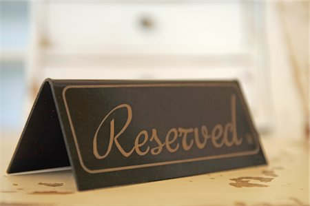 Reserved sign on table Stock Photo - Premium Royalty-Free, Code: 689-05611675