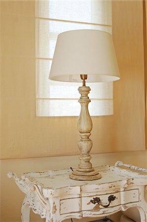 Table lamp on antique dresser Stock Photo - Premium Royalty-Free, Code: 689-05611672