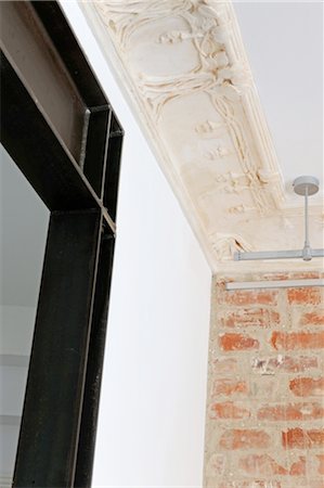 embellish - Brick wall and ornate ceiling Stock Photo - Premium Royalty-Free, Code: 689-05611785