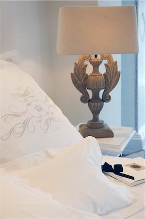 Pillow with imprint and bedside lamp Stock Photo - Premium Royalty-Free, Code: 689-05611835