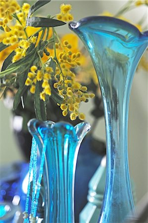 flower decoration - Yellow flowers in blue glass vase Stock Photo - Premium Royalty-Free, Code: 689-05612112