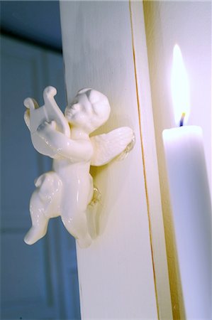 Small Putto and burning candle Foto de stock - Sin royalties Premium, Código: 689-05612213