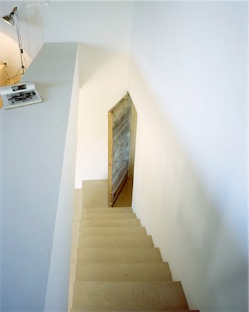 stairs inside house - Stairs and door in a house Stock Photo - Premium Royalty-Free, Code: 689-05612245