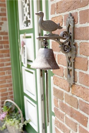 exterior (outer side or surface of something) - Bell and duck figurine at front door Stock Photo - Premium Royalty-Free, Code: 689-05612464