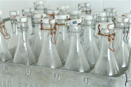 rusted objects images - Glass bottles with swing tops in a box Stock Photo - Premium Royalty-Free, Code: 689-05612529