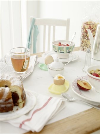 fruit on table - Laid breakfast table Stock Photo - Premium Royalty-Free, Code: 689-05612560