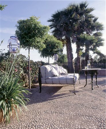 Bench and table on Mediterranean terrace Stock Photo - Premium Royalty-Free, Code: 689-05612637