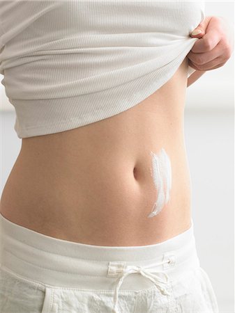 Cream streaks on a belly Stock Photo - Premium Royalty-Free, Code: 689-03124831