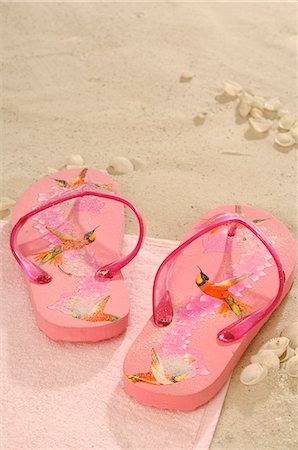 pink flip flops beach - Pink flip flops in the sand Stock Photo - Premium Royalty-Free, Code: 689-03125796