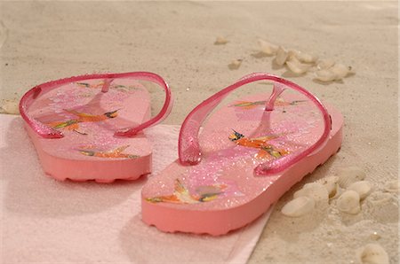 pink flip flops beach - Pink flip flops in the sand Stock Photo - Premium Royalty-Free, Code: 689-03125797