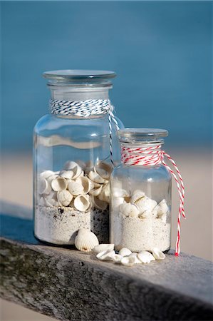 Two pharmacy bottles filled with sand and shells Stock Photo - Premium Royalty-Free, Code: 689-03125838