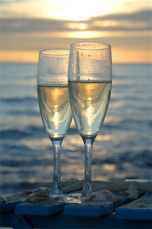 Two glasses of sparkling wine in the sunset at the sea Stock Photo - Premium Royalty-Free, Code: 689-03125967