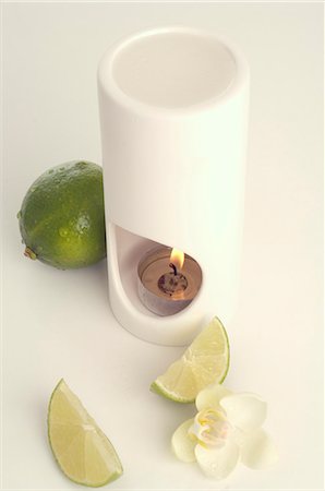 Aroma lamp,limes and orchid blossoms Stock Photo - Premium Royalty-Free, Code: 689-03126670