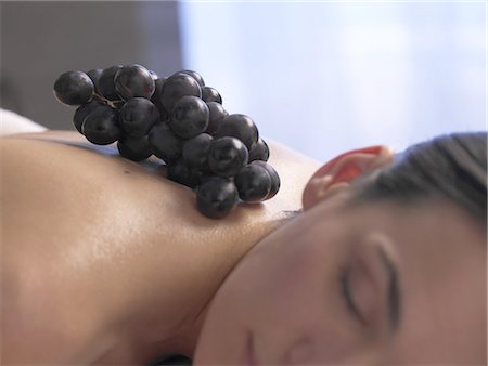 photo of model woman with grapes - Woman lying on a massage table Stock Photo - Premium Royalty-Free, Code: 689-03127329