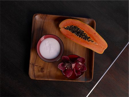 spa model - Plate with a papaya,creme and a blossom Stock Photo - Premium Royalty-Free, Code: 689-03127352