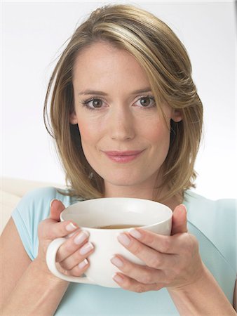 Woman with a cup of coffee Stock Photo - Premium Royalty-Free, Code: 689-03127423