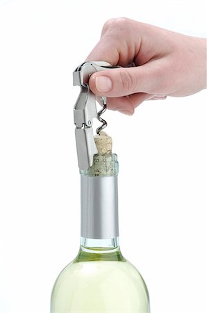 simsearch:689-03128420,k - Open wine bottle with a waiter's corkscrew Fotografie stock - Premium Royalty-Free, Codice: 689-03128394