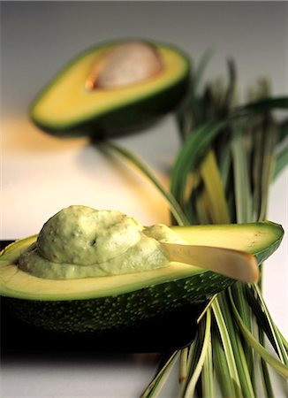 Avocado half with body mask (Persea americana) Stock Photo - Premium Royalty-Free, Code: 689-03123926