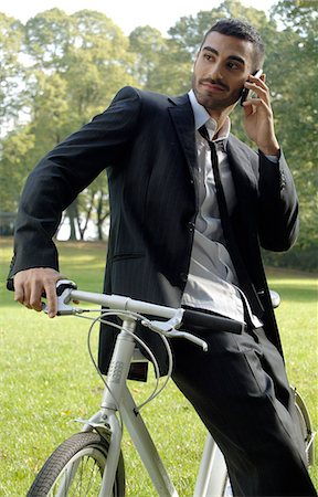 suit grass cellphone - Man enjoying time-out in the park Stock Photo - Premium Royalty-Free, Code: 689-03131005