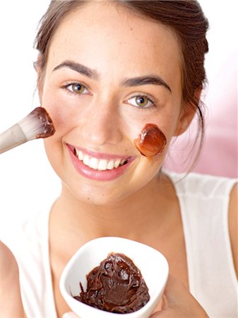 faces pleasure - Brunette woman with a chocolate mask Stock Photo - Premium Royalty-Free, Code: 689-03733002