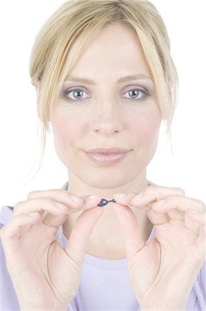 face tablet - Woman holding capsule Stock Photo - Premium Royalty-Free, Code: 689-03733118