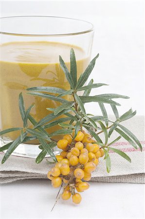 Sea buckthorn branch and juice Stock Photo - Premium Royalty-Free, Code: 689-03733140