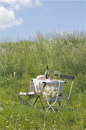 Bread and wine on table outdoors Stock Photo - Premium Royalty-Free, Code: 689-03733236