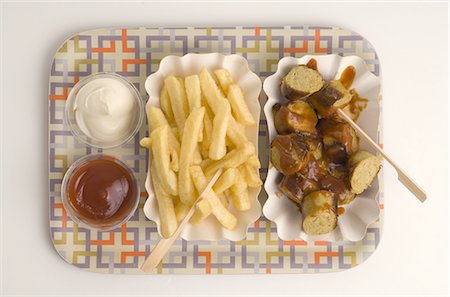 french fry top view nobody - Currywurst with French Fries with ketchup and mayonnaise Stock Photo - Premium Royalty-Free, Code: 689-03733288