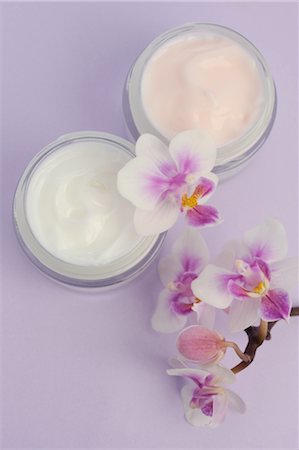 Cream jars and orchid blossoms Stock Photo - Premium Royalty-Free, Code: 689-03733503