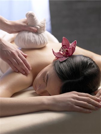 female body massage photo - Woman on massage table with compress Stock Photo - Premium Royalty-Free, Code: 689-03733627