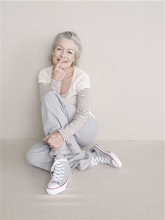 single old woman - Senior woman sitting on floor Stock Photo - Premium Royalty-Free, Code: 689-03733664