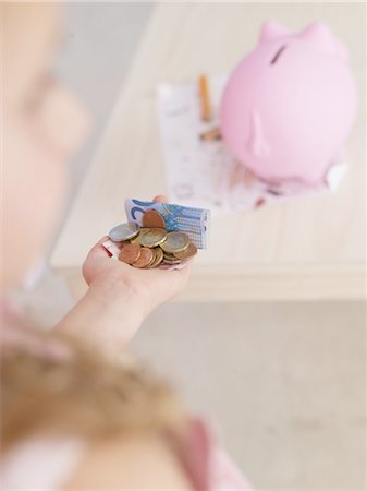 penny - Money in hand and piggy bank Stock Photo - Premium Royalty-Free, Code: 689-03733699