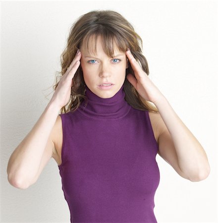 disease - Woman massaging her temples Stock Photo - Premium Royalty-Free, Code: 689-03733690