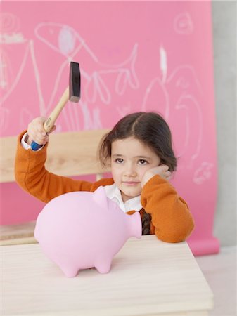 simsearch:614-08872581,k - Girl with hammer and piggy bank Fotografie stock - Premium Royalty-Free, Codice: 689-03733693