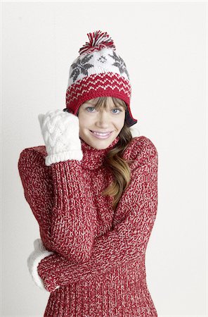 Woman wearing pullover, gloves and wooly hat Stock Photo - Premium Royalty-Free, Code: 689-03733708