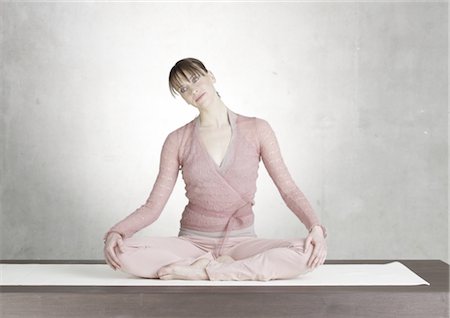 Woman in yoga pose Stock Photo - Premium Royalty-Free, Code: 689-03733745