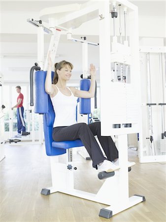 rehab - Woman exercising at a health club Stock Photo - Premium Royalty-Free, Code: 689-03733762