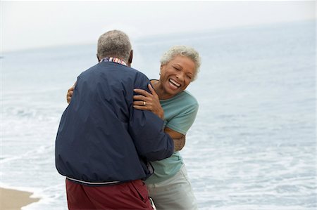 Senior couple embracing by ocean Stock Photo - Premium Royalty-Free, Code: 694-03318267