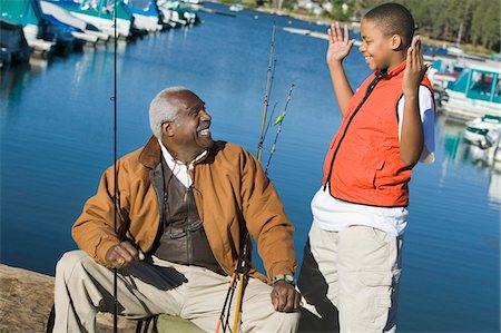 simsearch:694-03318999,k - Grandfather and grandson fishing, boy gesturing Fotografie stock - Premium Royalty-Free, Codice: 694-03318933