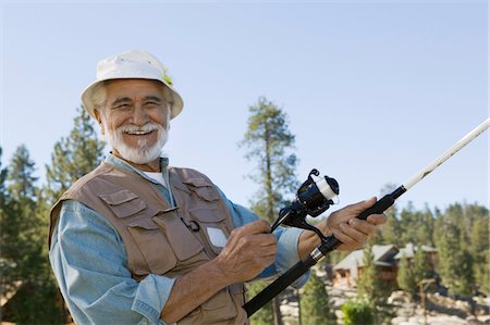 portrait fisherman older - Middle-aged man fishing, smiling, (portrait) Stock Photo - Premium Royalty-Free, Code: 694-03318952