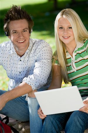 Student couple relaxing outdoors, (portrait) Stock Photo - Premium Royalty-Free, Code: 694-03319648