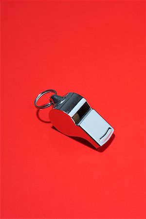 fischiettare - Whistle on red background in studio Fotografie stock - Premium Royalty-Free, Codice: 694-03325765