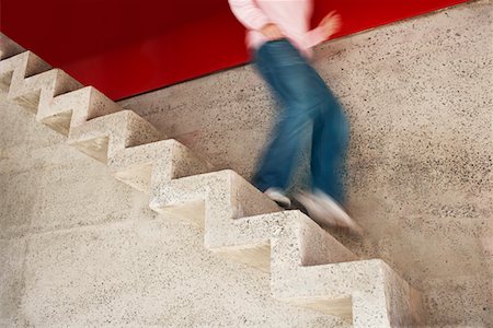 run stair - Man running down stairs, motion blur, low section Stock Photo - Premium Royalty-Free, Code: 694-03326299