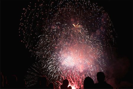 Shadows of spectators in front of fireworks Stock Photo - Premium Royalty-Free, Code: 694-03326761