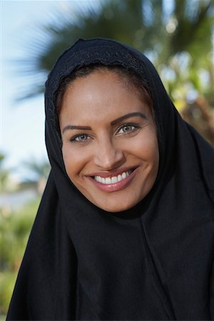 portraits one person muslim - Portrait of muslim woman in black headscarf Stock Photo - Premium Royalty-Free, Code: 694-03327105