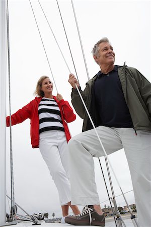fair haired mature male boat - Couple on yacht, low angle view Stock Photo - Premium Royalty-Free, Code: 694-03327246