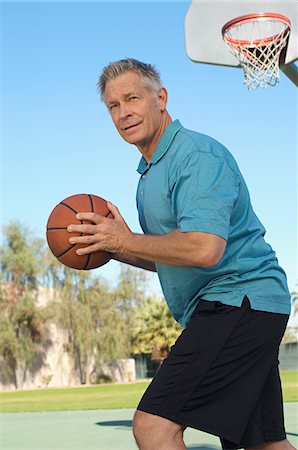 senior playground - Senior man playing basketball on outdoor court Stock Photo - Premium Royalty-Free, Code: 694-03327290